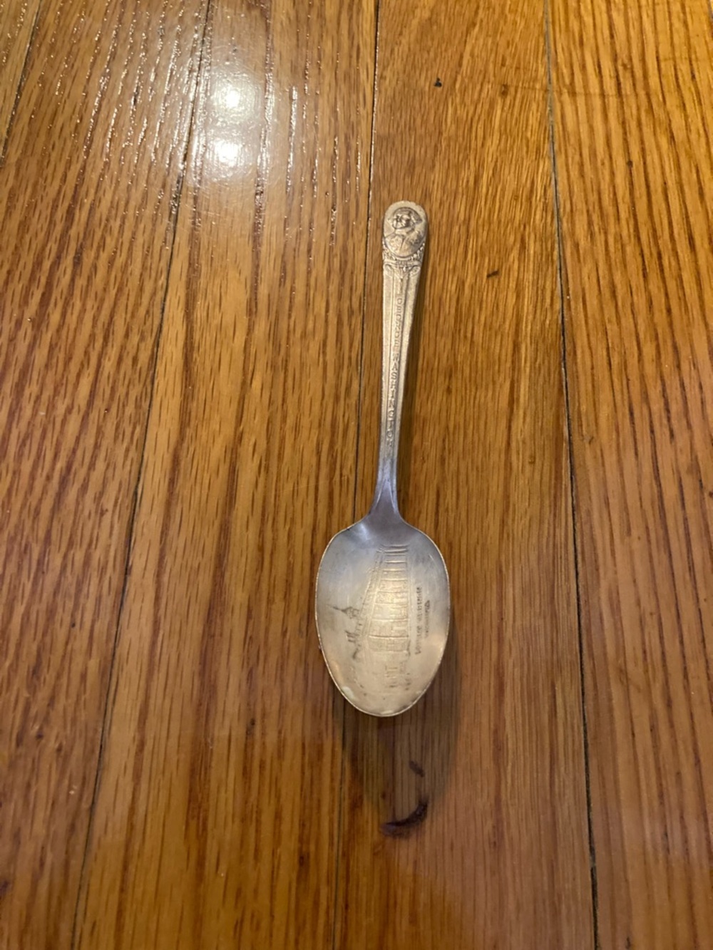 Ornate Cream-Colored Decorative Souvenir Spoon